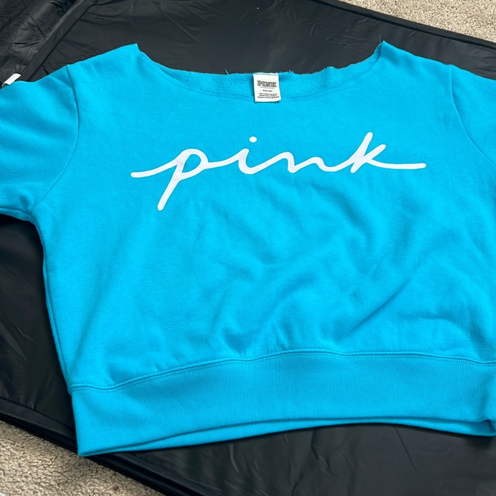 Pink sweatshirt that can be worn over or one side of shoulders size medium